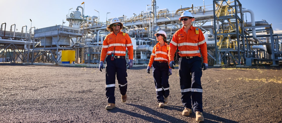 Three Shell QGC employees walking at the Ruby Jo central processing plant.