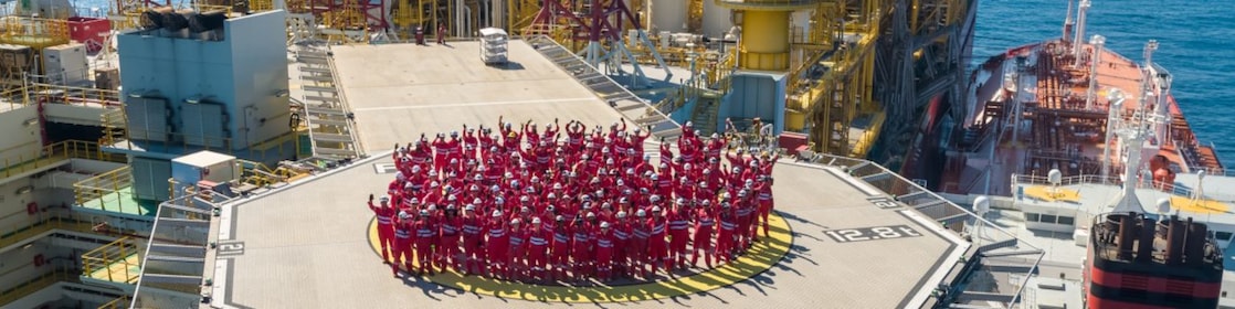 Workman walking up the stairs at a construction site
