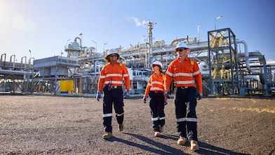 Three Shell QGC employees walking at the Ruby Jo central processing plant.
