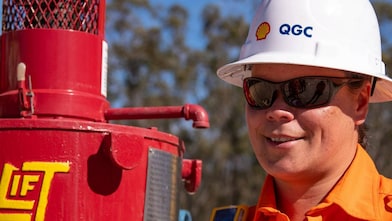 Engineer looking up at platform under construction