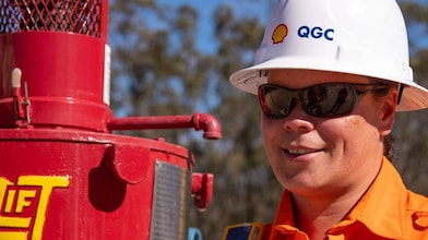 Engineer looking up at platform under construction