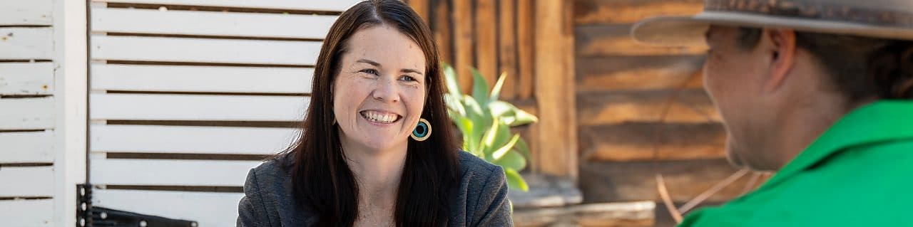 QGC employee engaging with community members.