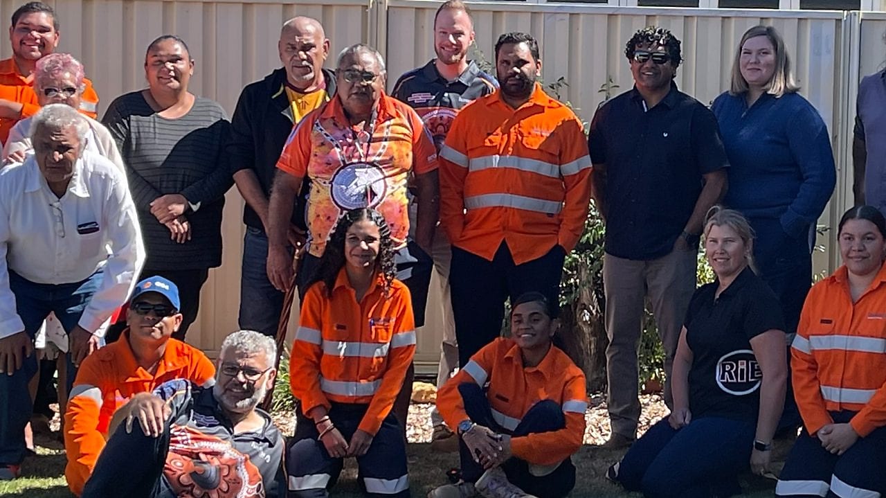 worker on a site writing on a paper while standing