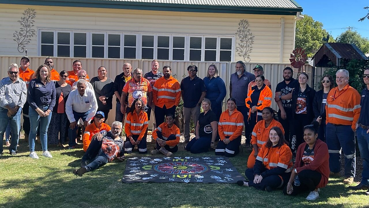 worker on a site writing on a paper while standing