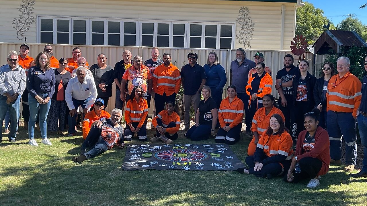 worker on a site writing on a paper while standing