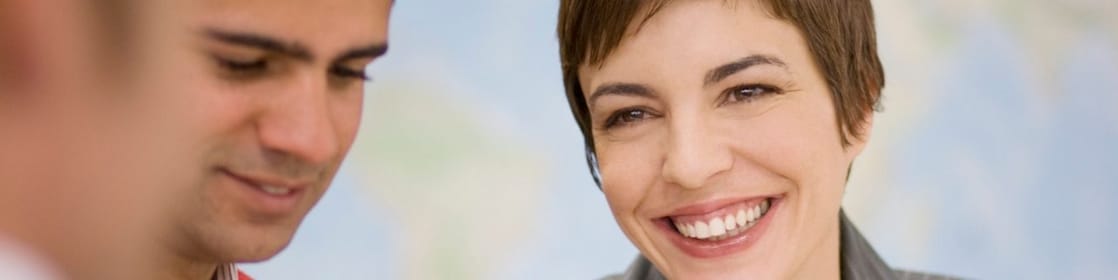 Business people having meeting over blueprints