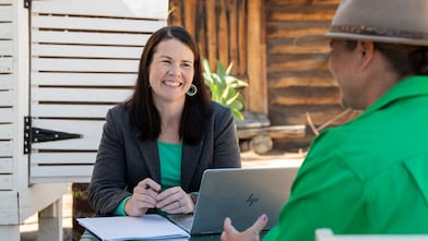 QGC employee engaging with community members.