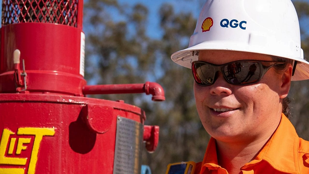 Engineer looking up at platform under construction