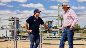 Landholder and Shell QGC representative discussing operations on rural land.