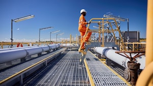 Personnel carrying out work at Shell QGC facilities.