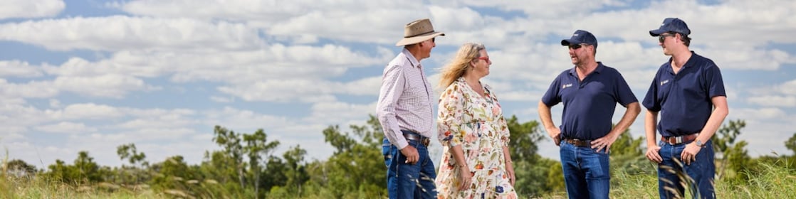 QGC employee sitting talking with landholder