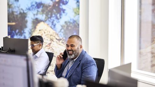 An office worker speaks on his mobile phone.