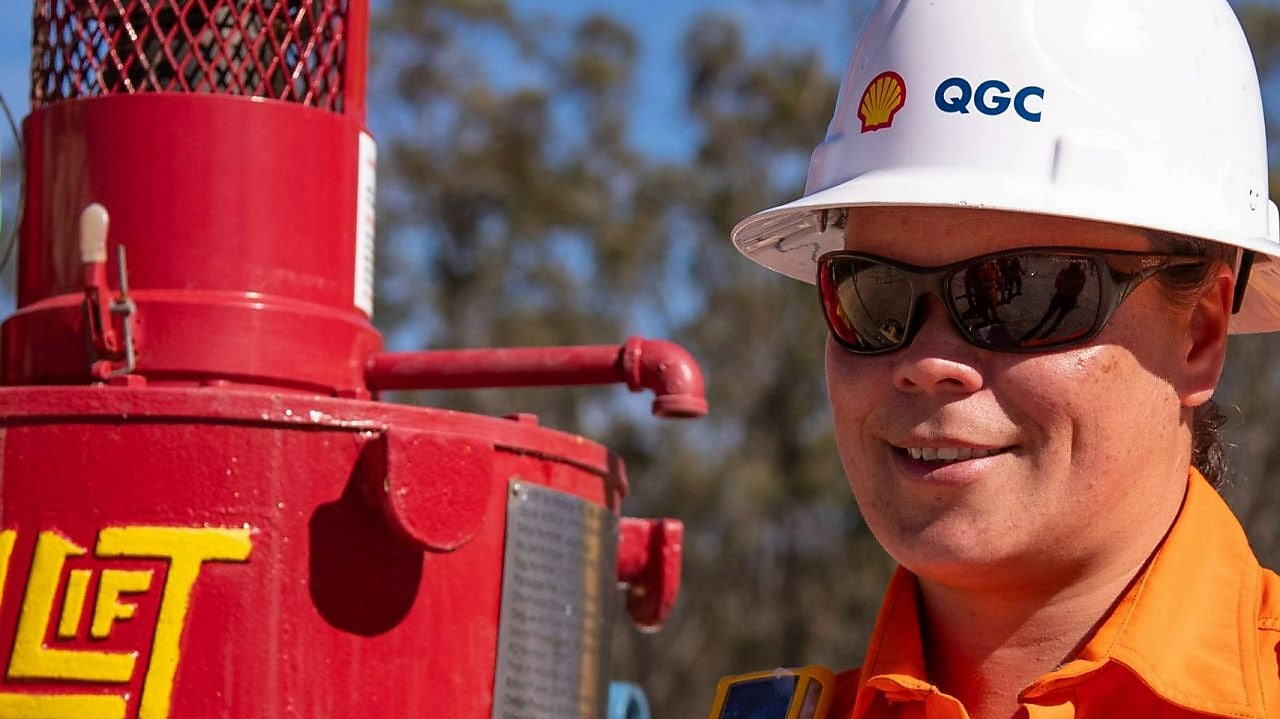 Engineer looking up at platform under construction