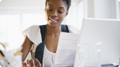 Women accessing Shell Card portal on her laptop.