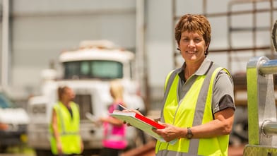Woman smiling at construction site