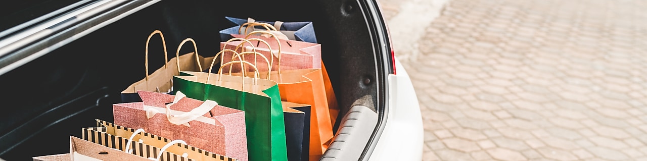 muliti-coloured bags placed in the boot of the car