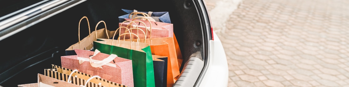 muliti-coloured bags placed in the boot of the car