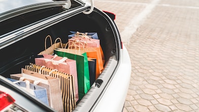 muliti-coloured bags placed in the boot of the car