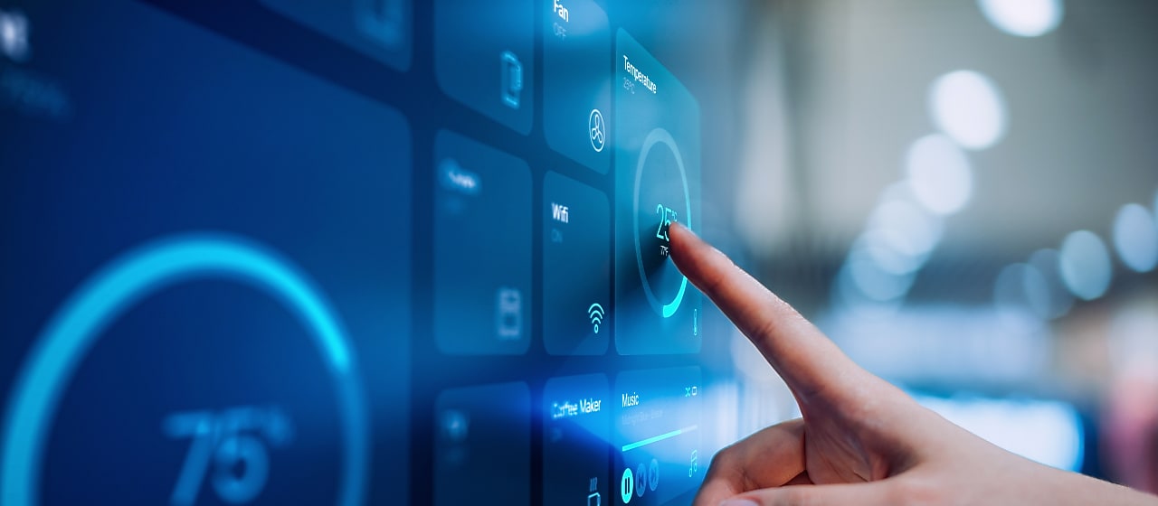 Finger pointing a screen with data