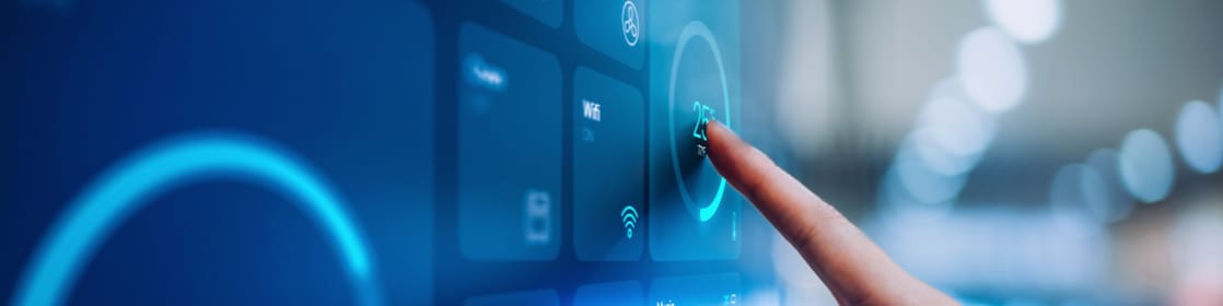Finger pointing a screen with data