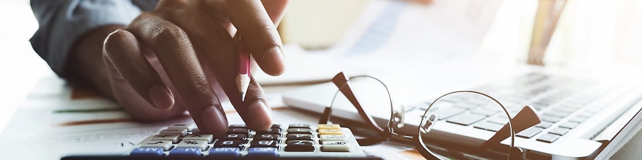 Personal entering data into a calculator