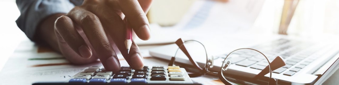 Personal entering data into a calculator