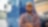 Happy African American truck driver with crossed arms looking at camera.