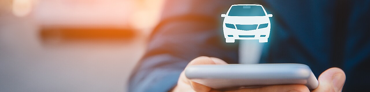 Intelligent car app on smart phone concept, intelligent vehicle and smart cars concept. Person with smart phone on street, car in background and wireless communication with car.