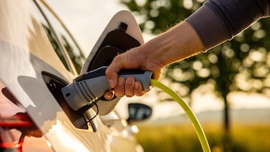 Man recharging his EV