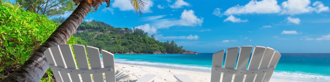 Two empty chairs on a beach
