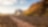 A low-angle view of a truck driving on a remote Australian road