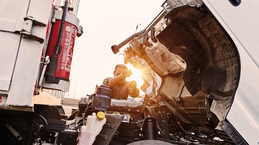 Driver checking a truck engine at a Shell Truck Network site