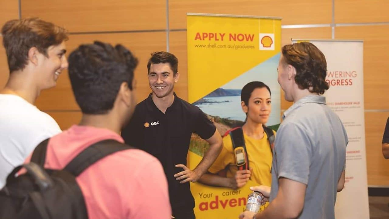 Tom interacting with people