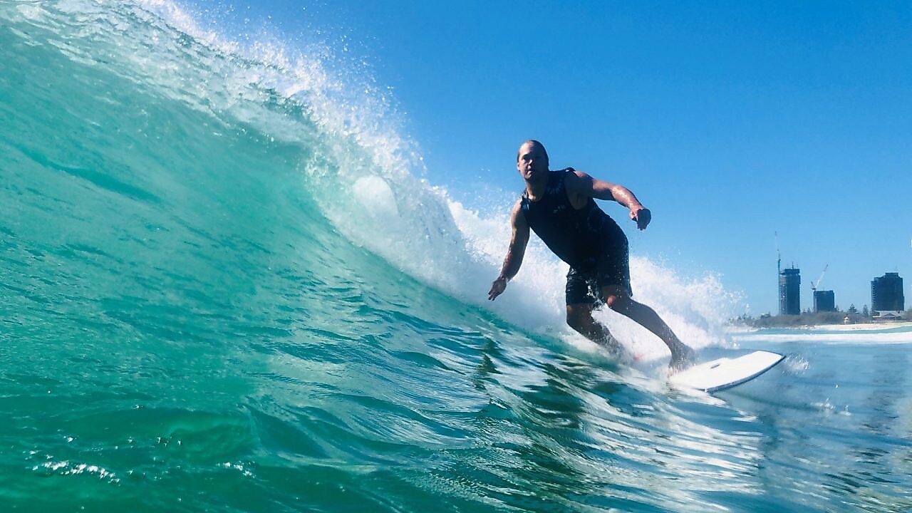 mitch surfing on surfboard