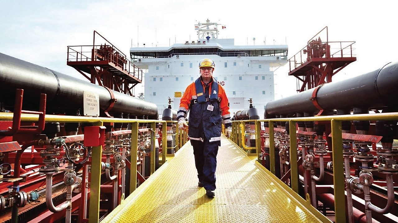 worker walking around a Shell vessel