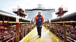 worker walking around a Shell vessel