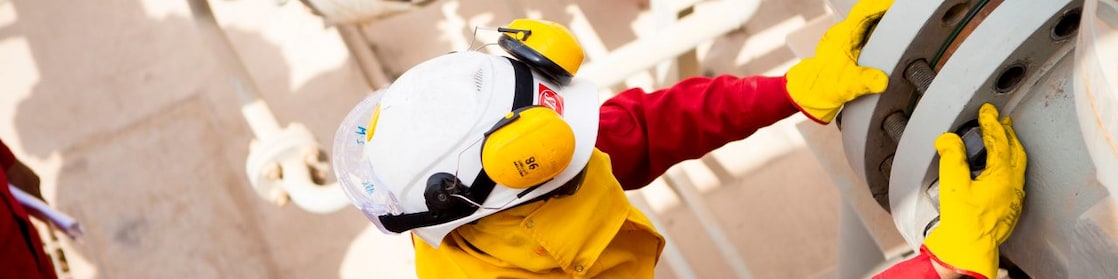 Worker wearing safety mask and gloves