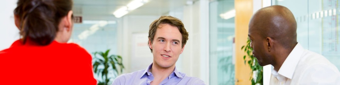 two employees interviewing a potential candidate