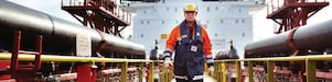 worker walking around a Shell vessel