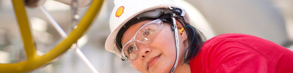 female employee inspecting equipment