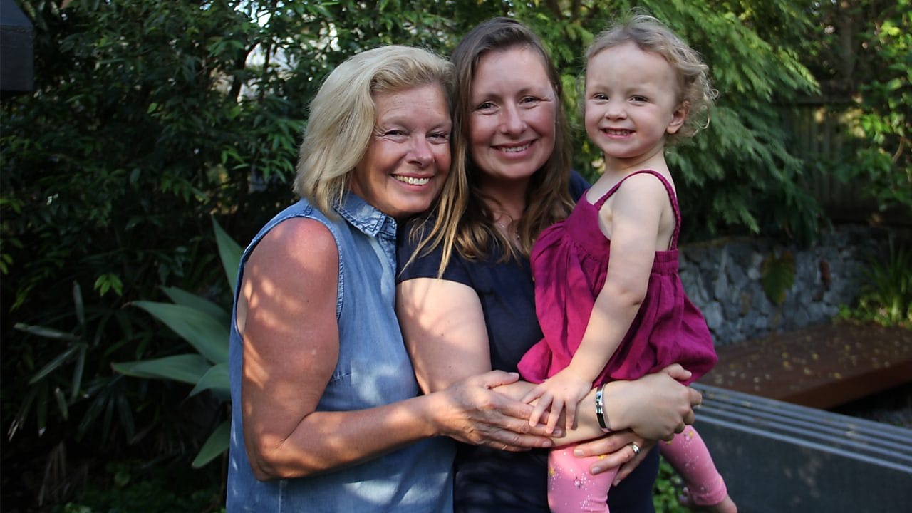 Woman carrying child