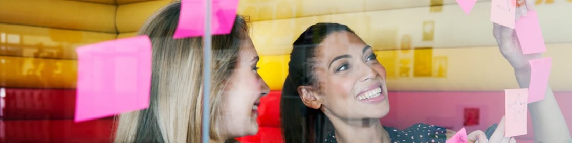 Female workers discussing work in dymanic work environment