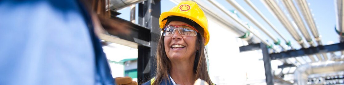 Female colleagues on site talking and smiling