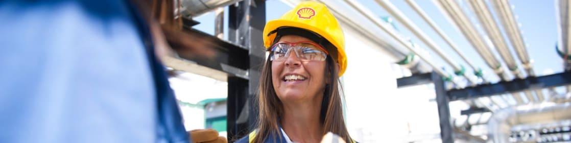 Female colleagues on site talking and smiling
