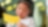 Young girl cutting paper with scissors.