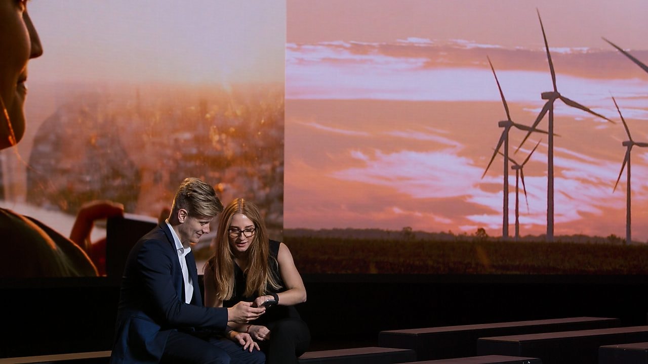 Girl and boy looking in the phone