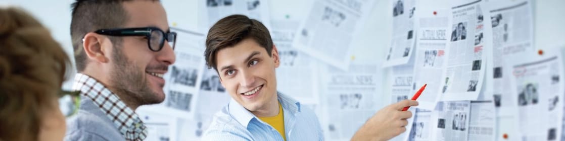 Students looking the newspaper ads
