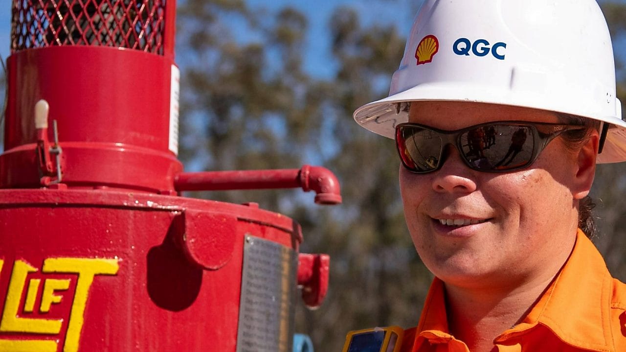 Engineer looking up at platform under construction