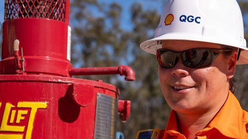 Engineer looking up at platform under construction