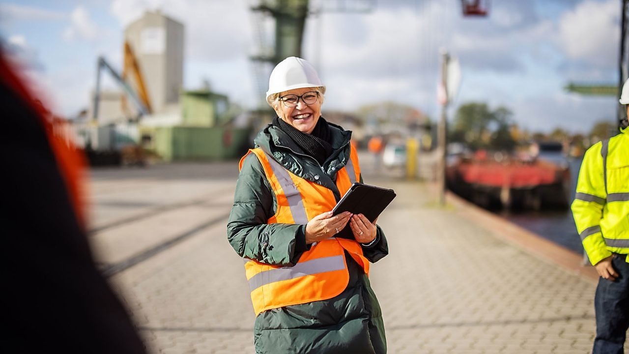 Smiling manager having a meeting with workers.